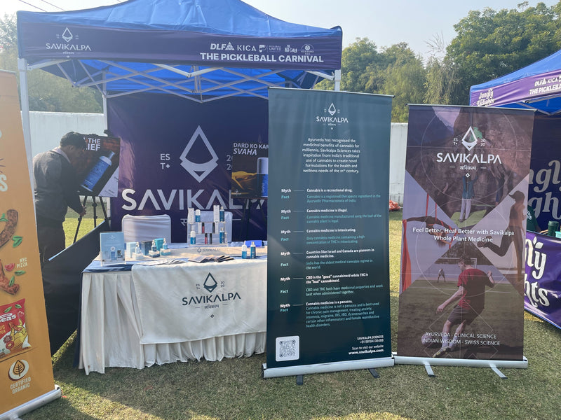 Savikalpa promotional booth at The Pickleball Carnival with product displays and information banners